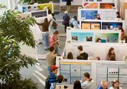 A Family Weekend poster session in the Wellin Atrium, Taylor Science Center.