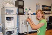 Sarah Andrus '12 studies insect samples in the lab.