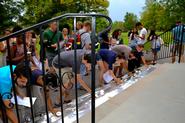 Students place candles on the steps of the Chapel at the conclusion of the 9/11 vigil.