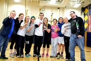 Members of the women's socccer team pose with some Special Olympics athletes after their basketball game.