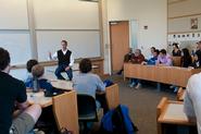 Peter Tague '88 takes questions from students in Erol Balkan's International Finance class.