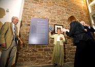 Edward and Virginia Taylor unveil the plaque dedicated to them in the Taylor Science Center lobby.