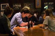 A Trivia Night team works on its answers. Photo by Greg Huffaker '09.