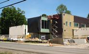 Construction crews finish the stone and terra cotta exterior of the Wellin Museum of Art.