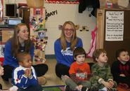 Women's basketball team members Margaret Smith '15 and Rachel Sobel '15 with some new friends at UCP.