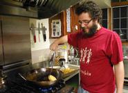 Juancho Hurtado '11 cooks up a meal at the Co-op.