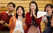 Students enjoy a performance at the Chinese New Year celebration.