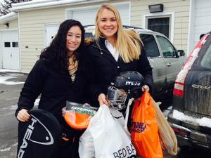Samantha Sherman '15 and Katie Steates '15 prepare to deliver sports equipment to the House of Good Shepherd.