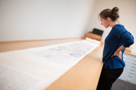  Professor Julie Staff looks over Yun-Fei Ji's work 