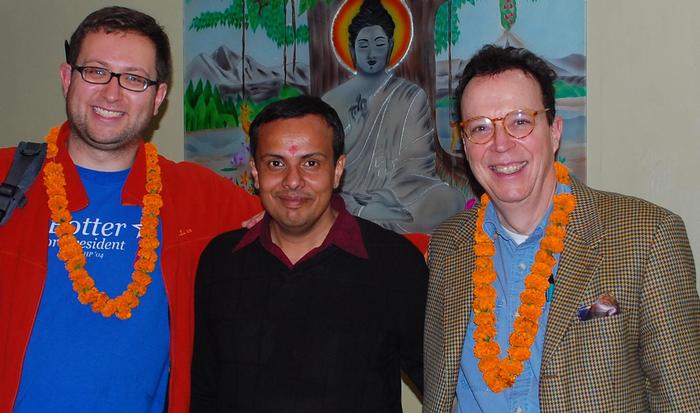 From left, ITS Educational Technologist Ted Fondak, Assistant Professor of Religious Studies Abhishek Amar and Professor of French John O'Neal in front of a painting of the Buddha in India.