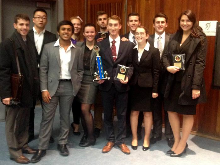 Hamilton's 2013-14 Mock Trial team with theri first place award at the University of Rochester Invitational.