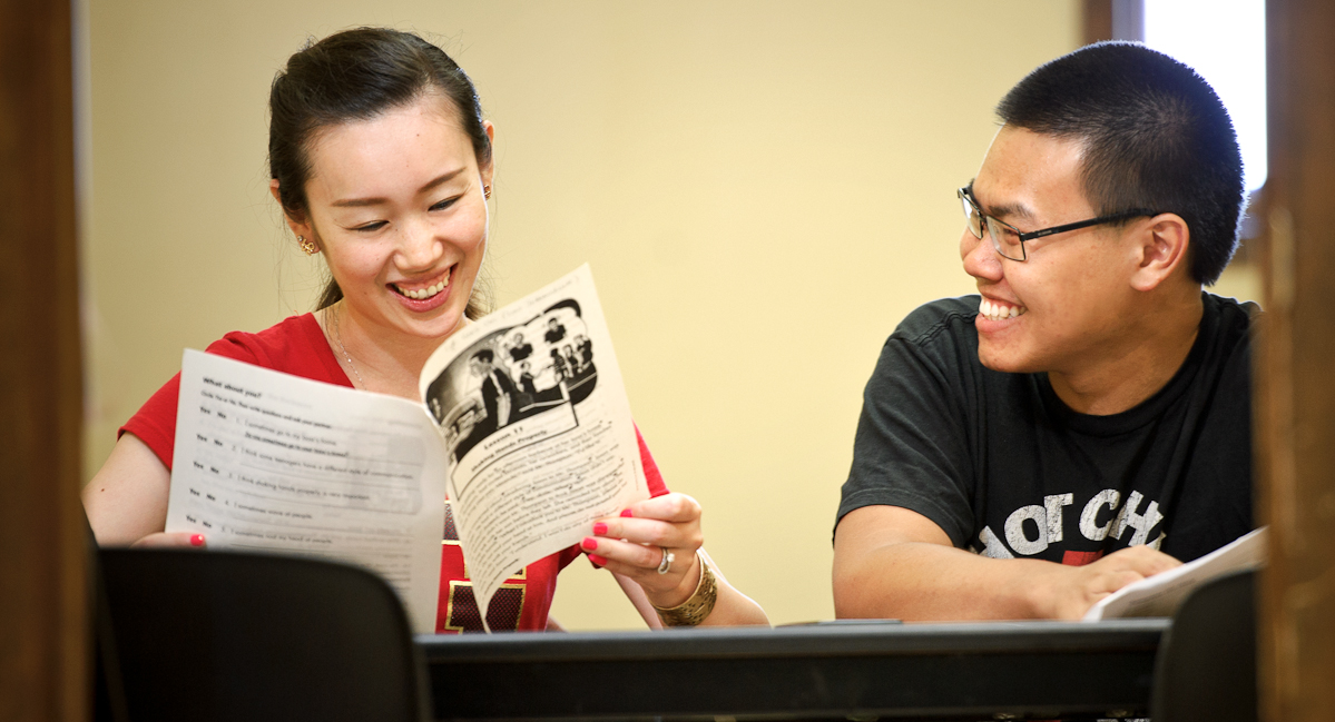 Tanapat (Ice) Treyanurak '17, right, tutors immigrant Lucy Wang in ESL at BOCES Utica Access site. 