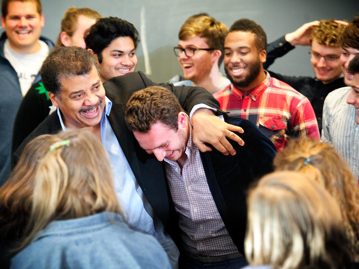 Neil deGrasse Tyson shares a laugh with students after he spoke with them in Taylor Science Center.