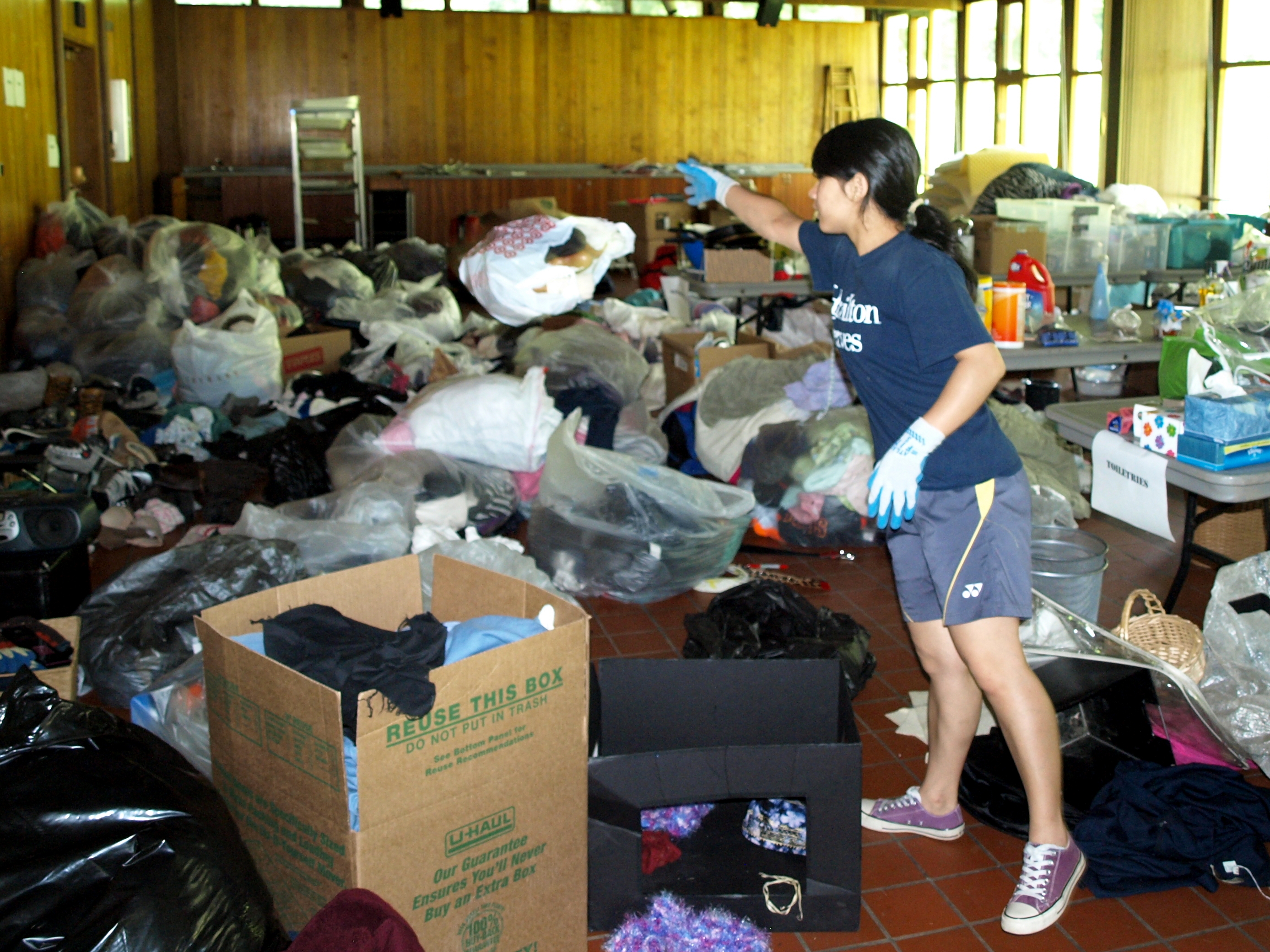 Akritee Shrestha '13 adds to the growing pile of clothing to be donated to the Salvation Army.