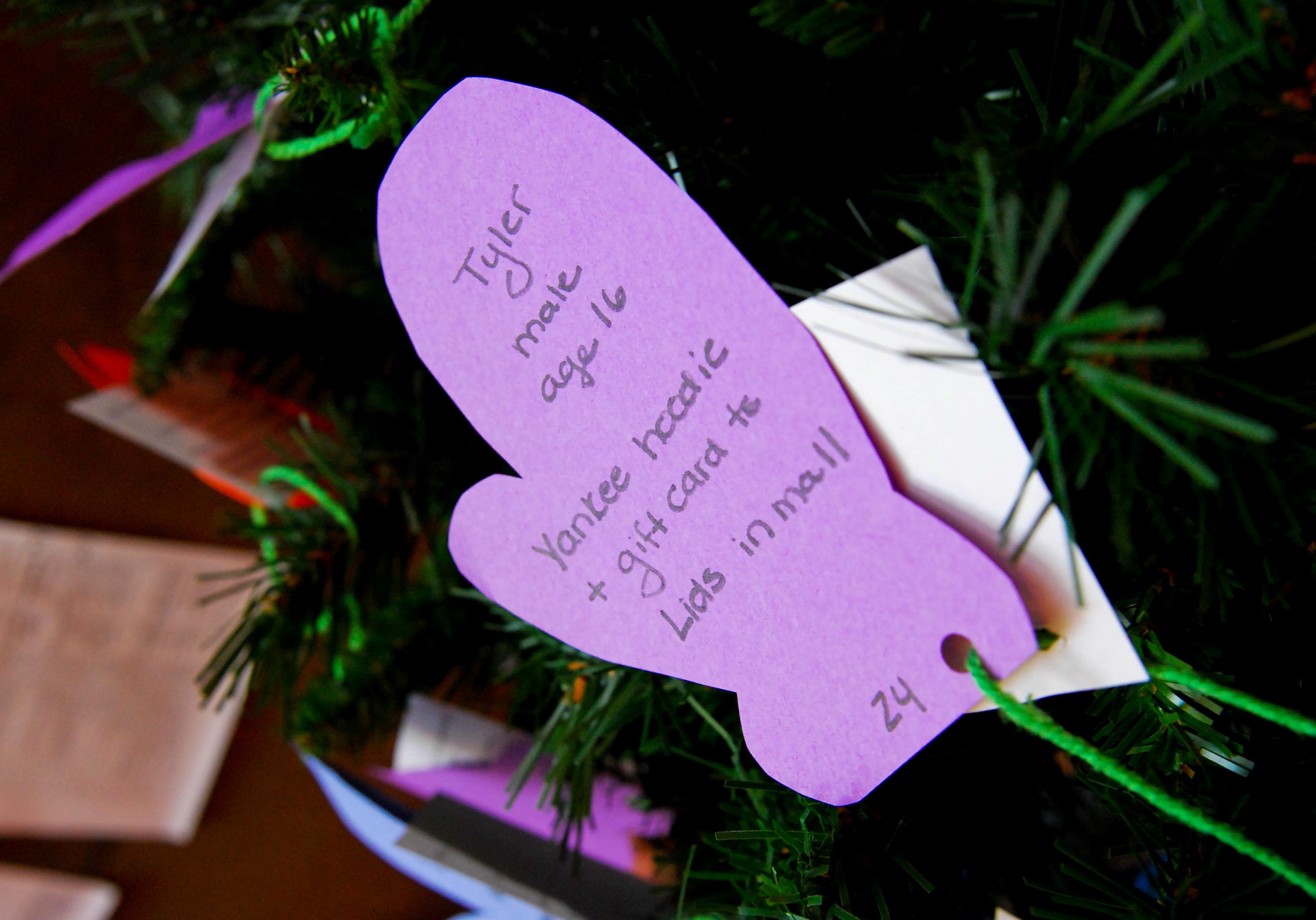 92 mittens are marked with children's holiday gift requests.