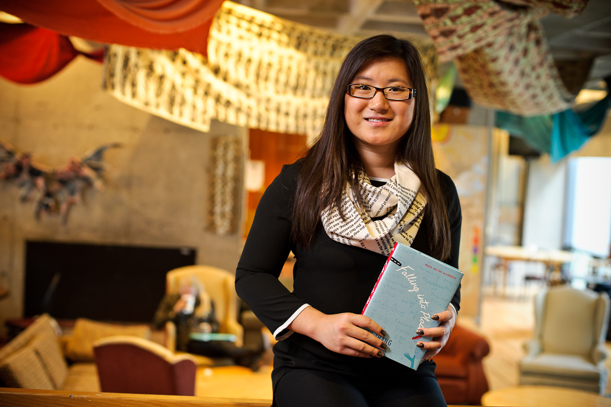 Amy Zhang '18 poses with her book <em>Falling Into Place</em>.