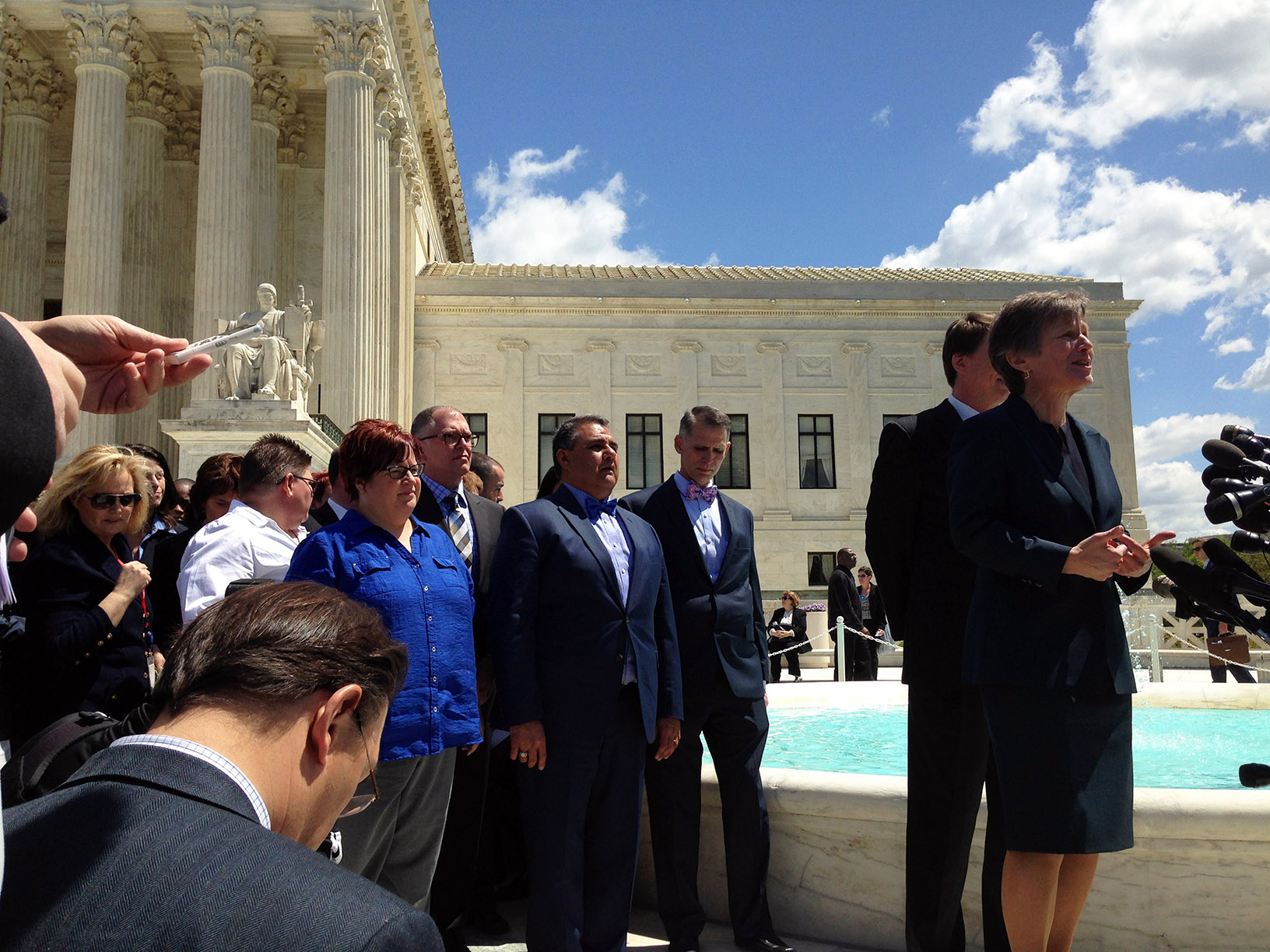 Mary Bonauto '83, right, speaks to the media with the plaintiffs.