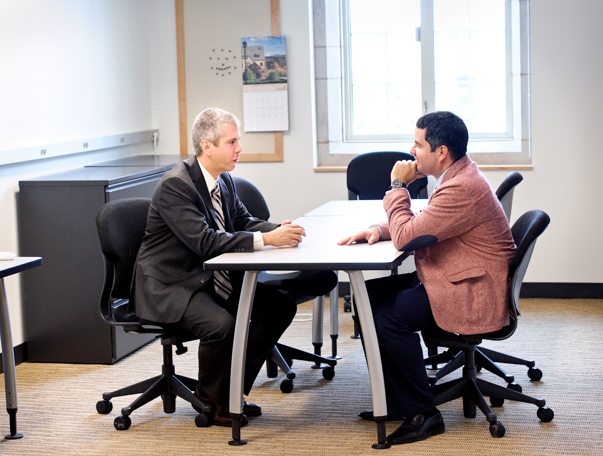 Assemblyman Anthony Brindisi, left, meets with Assistant Professor of Psychology Jose Causadias.