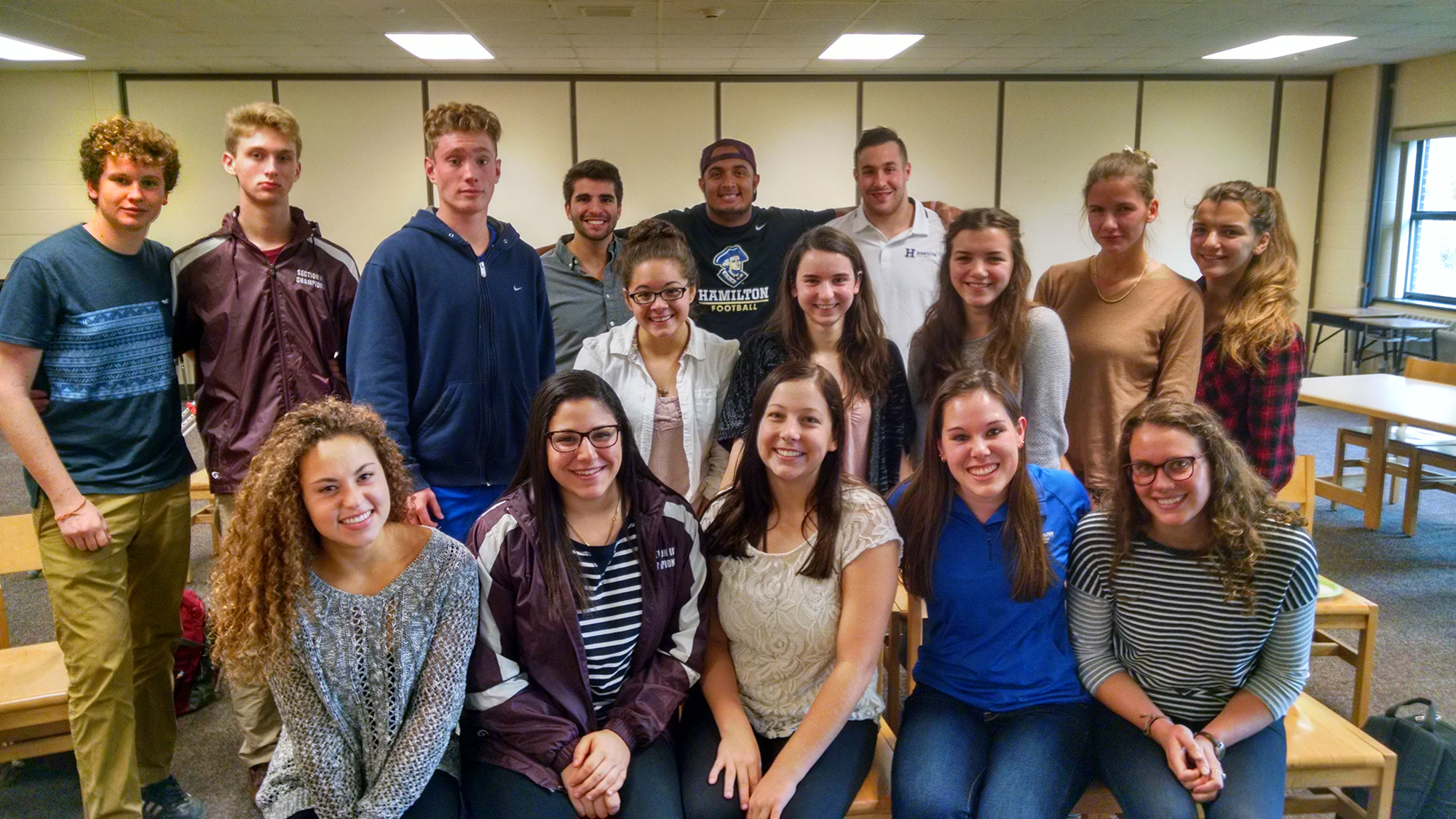 Hamilton College and Clinton High School athletes gather after a panel discussion.