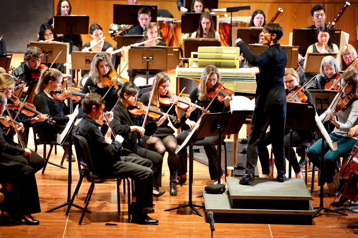 The Hamilton College Orchestra, conducted by Heather Buchman, practices in Wellin Hall.