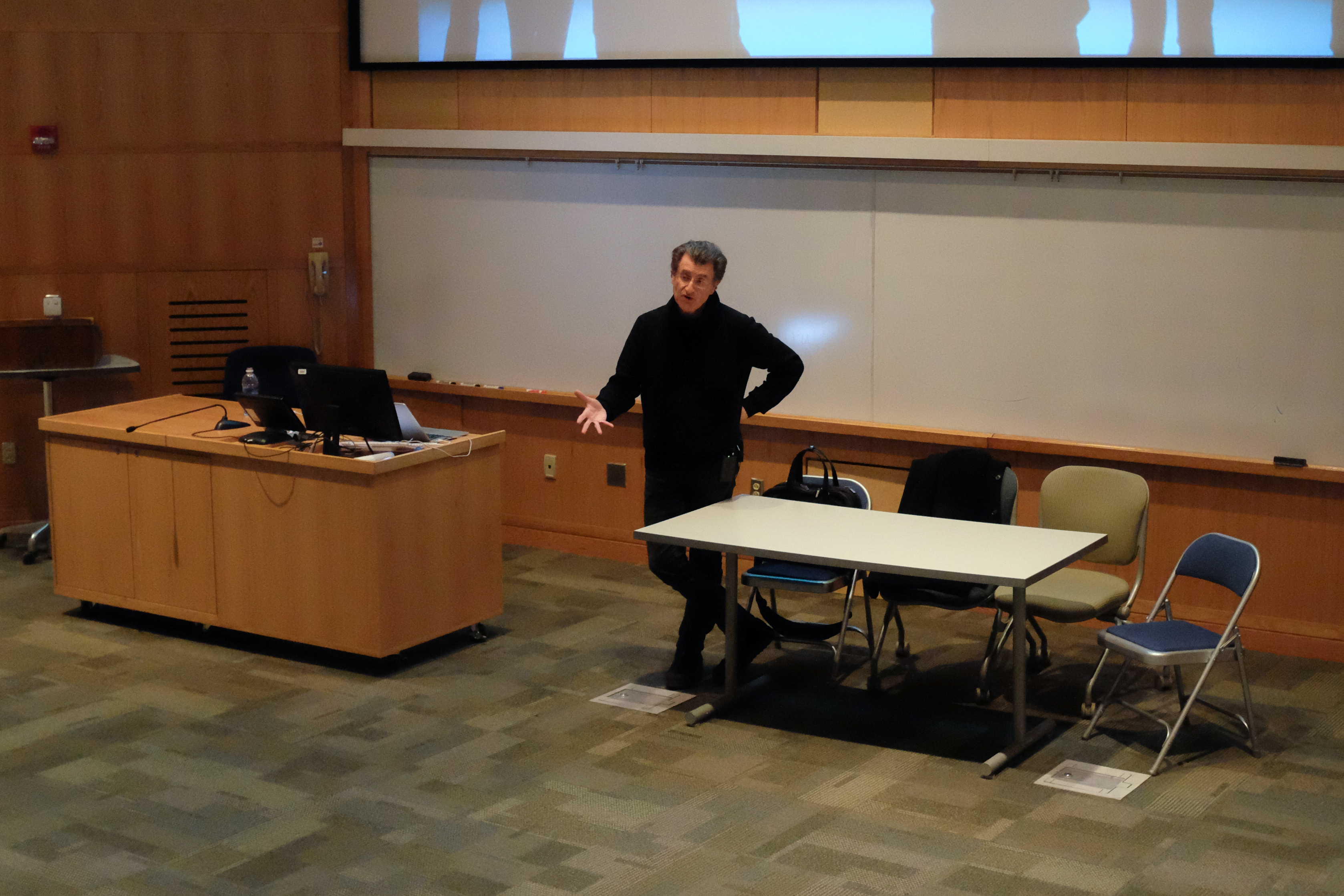 Artist Alfredo Jaar lectures in the Bradford Auditorium.