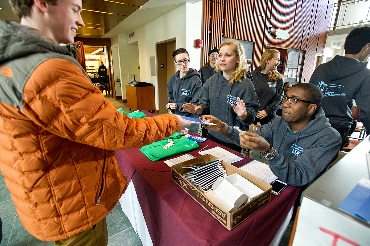 January admit Rowan Myers '19 checks in for Orientation with Eliana Zupcich '18, Katherine Spano '18 and David Dacres '18 at the Sadove Student Center.