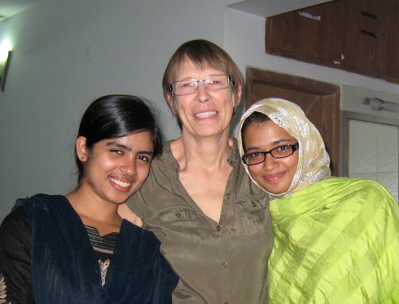 Professor of Biology Jinnie Garrett, center, with students at the Asian University for Women.