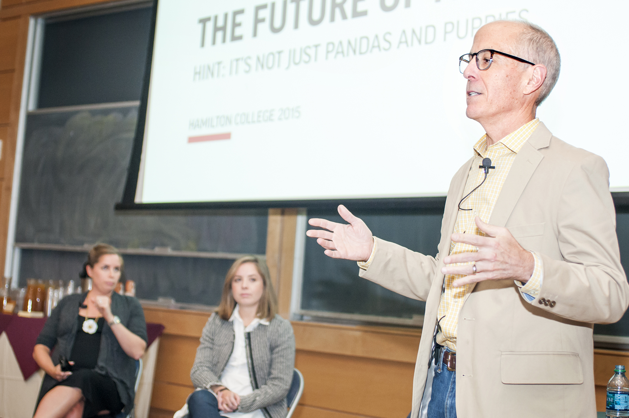 Associated Press Senior Vice President Jim Kennedy speaks at Hamilton as his daughters Liz Kennedy '05 and Meredith Kennedy '09 look on.