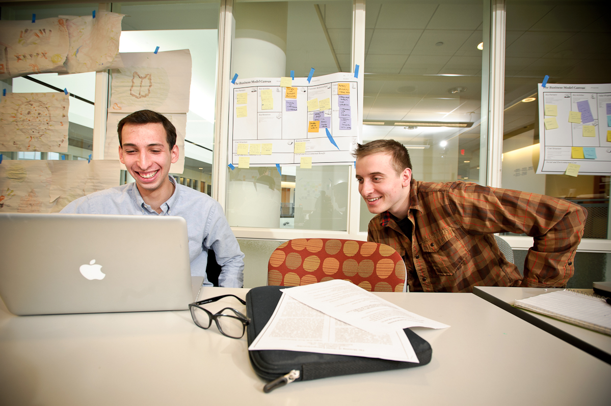 Matias Wolansky '16, left and Nick Pappageorge '14 work on their project during the Levitt Social Innovation Fellows Program.