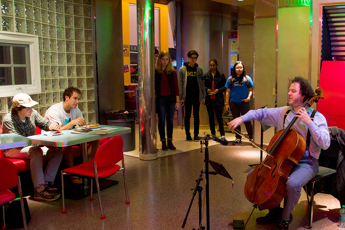 Cellist Matt Haimovitz performs outside the Diner on Friday, Nov. 6.