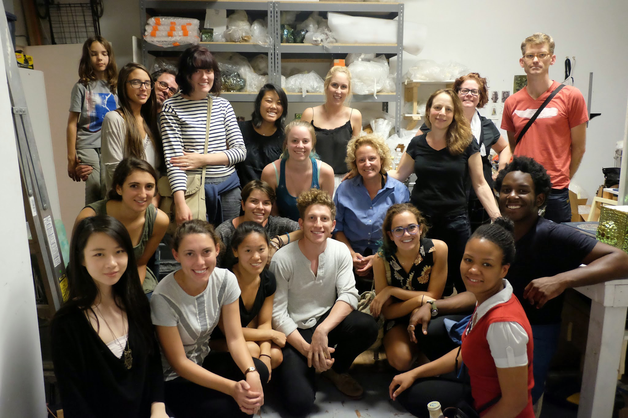 Hamilton senior art concentrators and faculty visit the studio of sculptor Julia Kunin, right center, in black. 