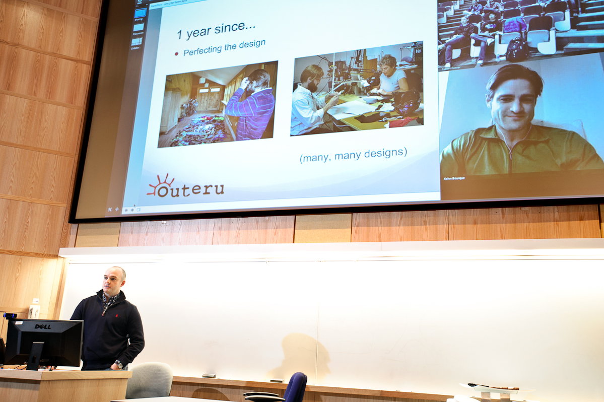 Kevin Bourque '05, left, and Joshua Kunkel '04, on screen, co-founders of Face Glove and winners of the 2012 Hamilton Pitch Competition, give a presentation on preparing for the pitch competition. 