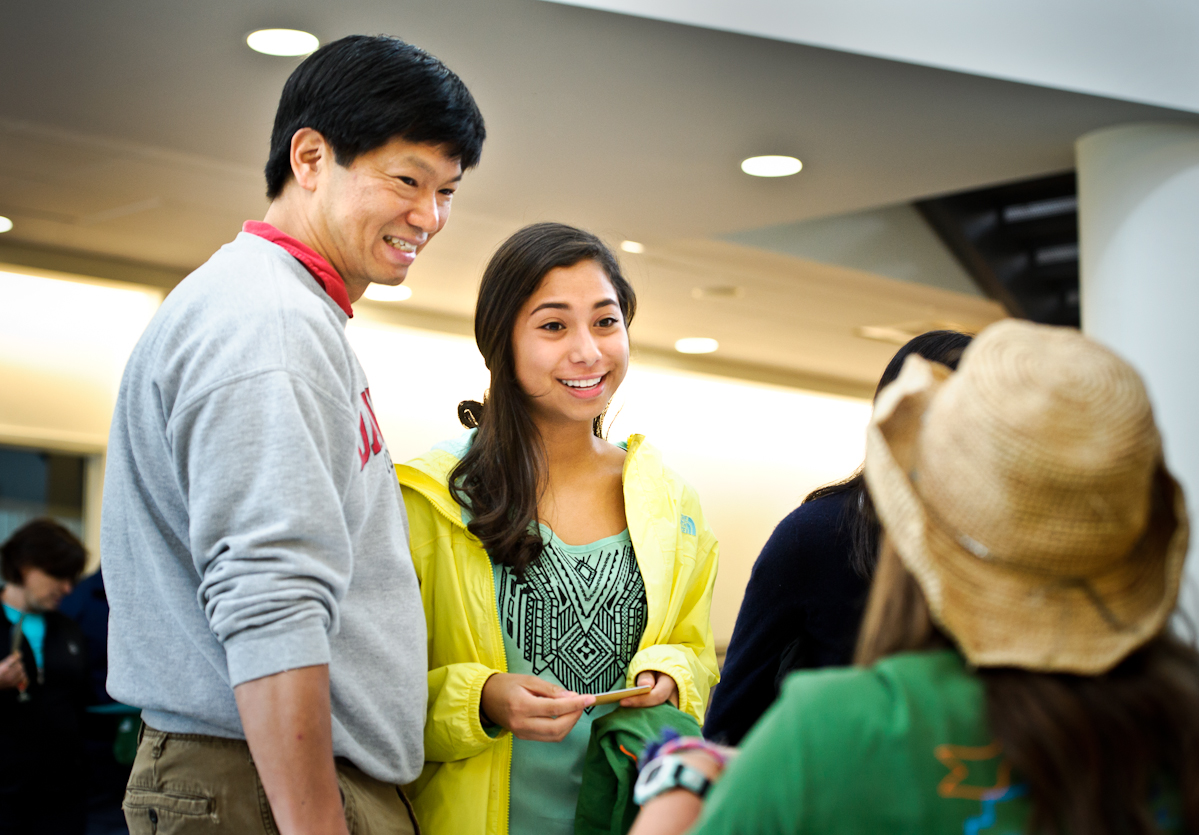 Charlotte Ze '18 checks in at the registration table in KJ.