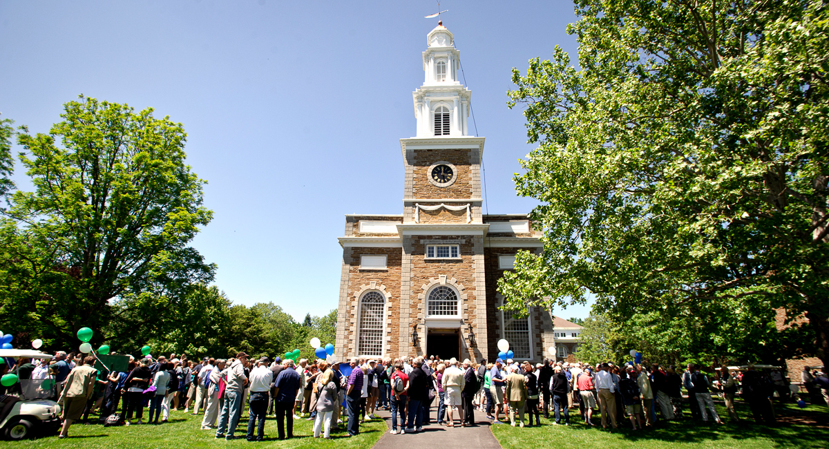 Alumni gather outside the Chapel after the parade.