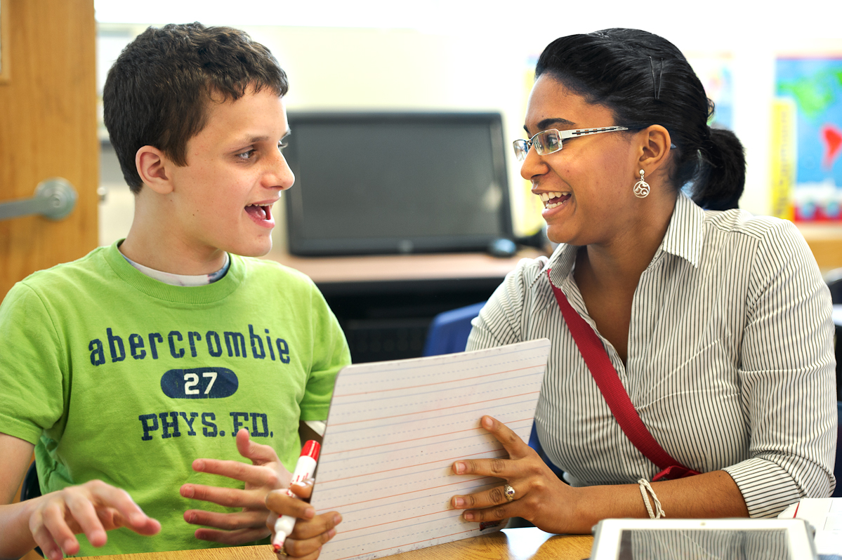 Rosmery Rodriguez '15 works with a child at her internship at The New England Center for Children.