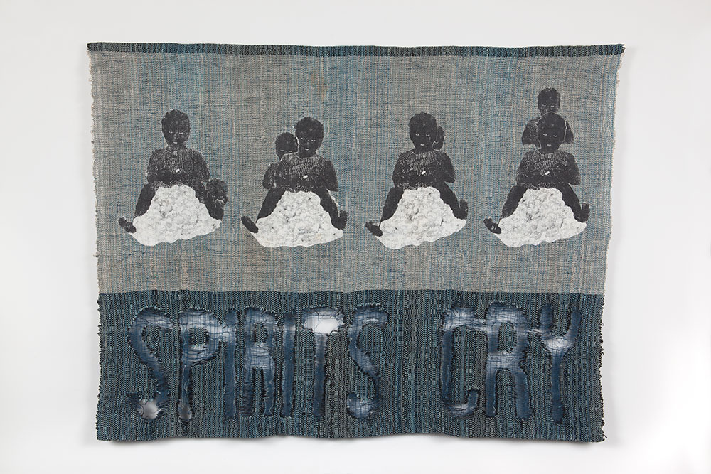 Spirits Cry, 2000. Image transfer on hand-woven linen, Amoco non-woven geotextile thread, and indigo dye. 36¼ × 49 3/8 in. (92.1 × 125.4 cm). Courtesy of the artist.