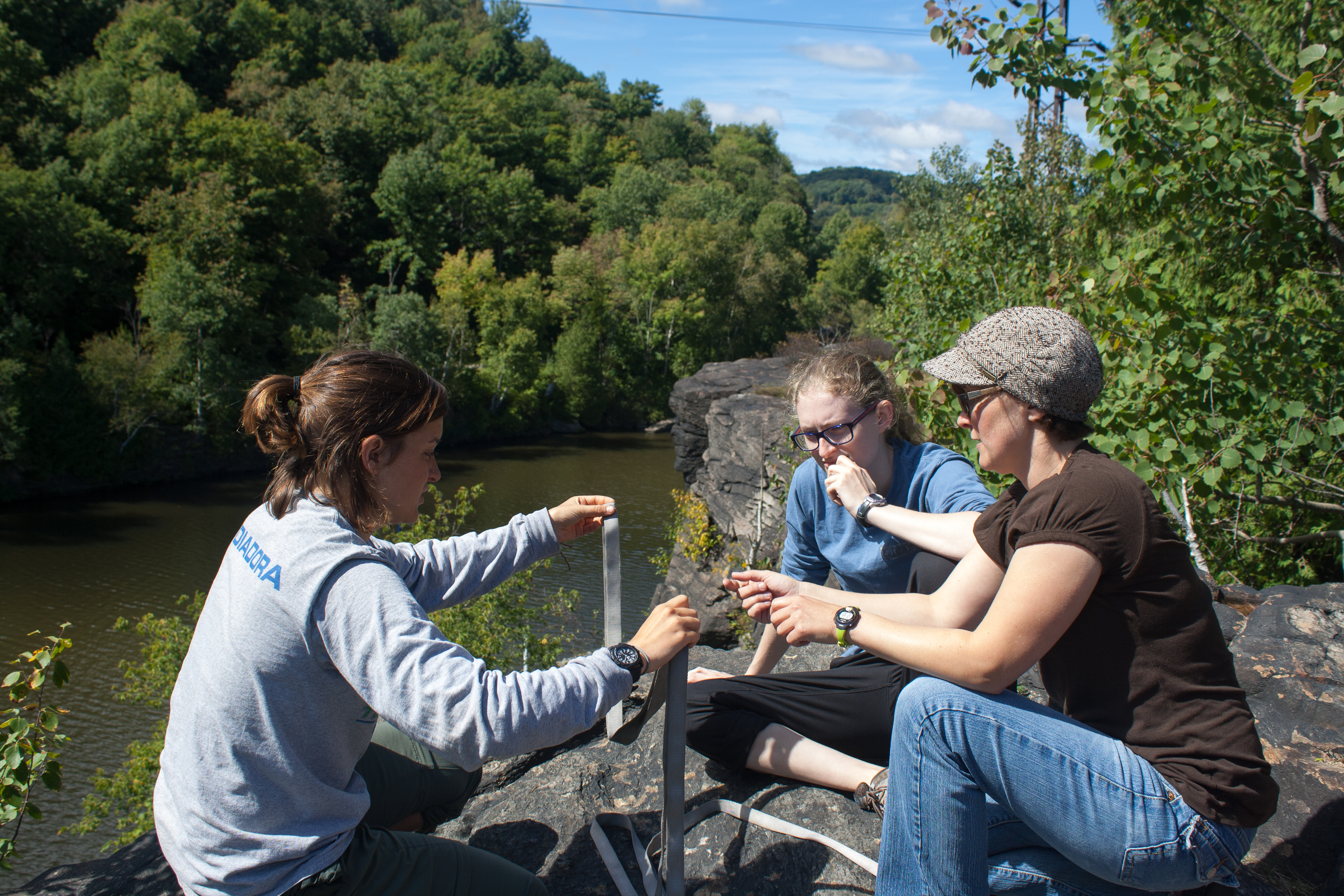 Sarah Weis Jillings, right, teaches Helen Santoro '15 how to tie a BHK (Big Honkin' Knot) as Grace Murphy '16 looks on.