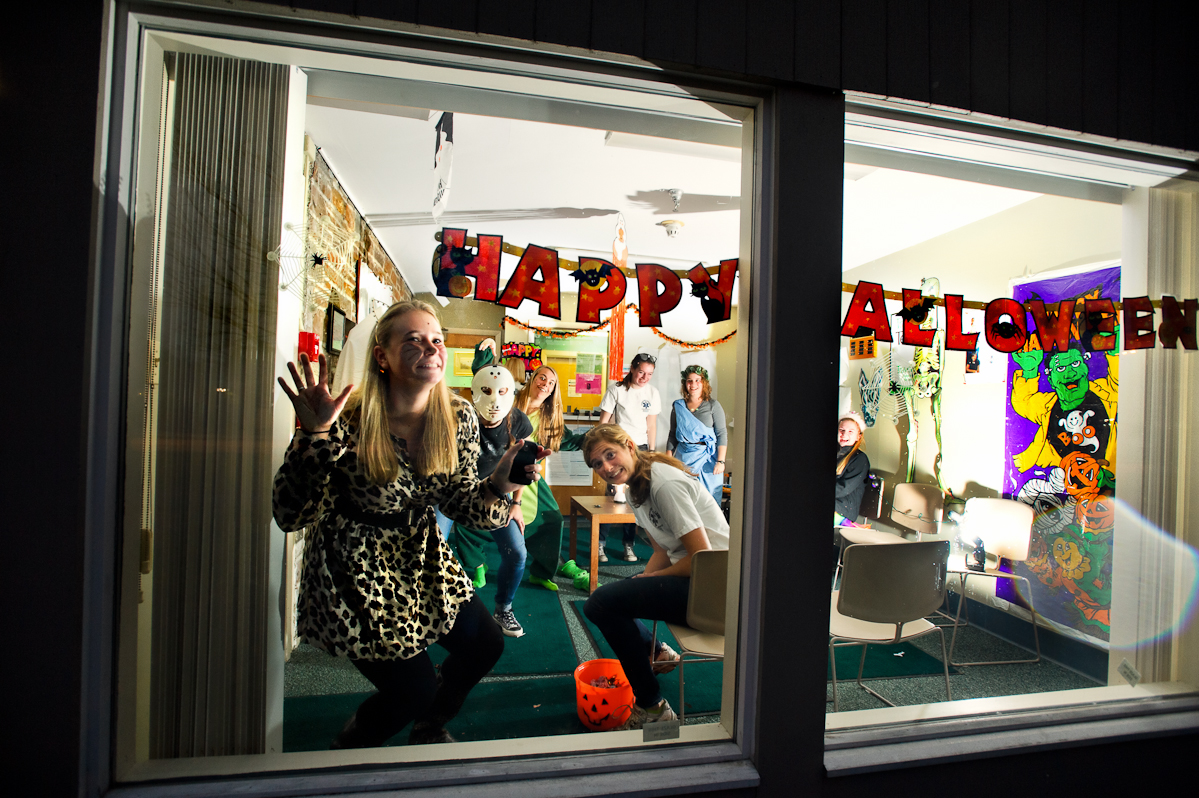 Katie Callahan '15, hangs out in the window of the the Health Center trying to entice trick or treaters during Trust Treat.