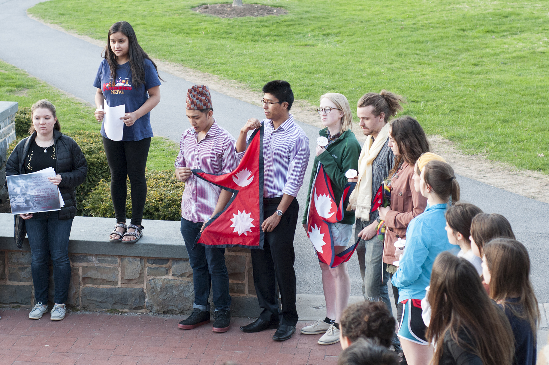 Nepali student Priti Kharel '18 addresses the crowd in front of Commons.