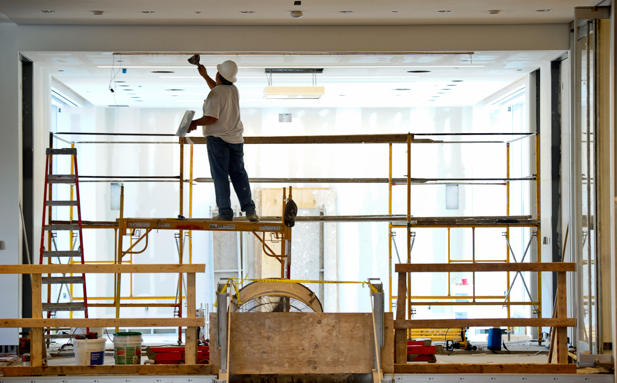 Construction workers busy themselves in the new Wellin Museum of Art last week.